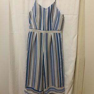 3/$28❤️Runway ready blue ,tan, black and white stripe romper size L